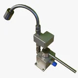 Metallic machine component with a handle on a white background