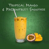 Tropical Mango & Passionfruit Smoothie with a glass and ingredients on a green background